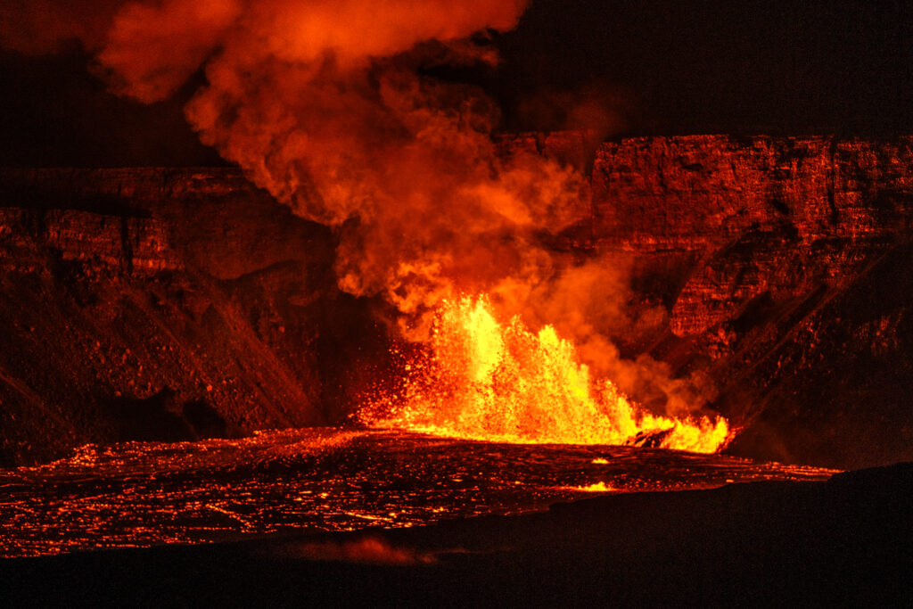 vollcano eruption as seen from Kilauea overlook shows volcano erupting at night.