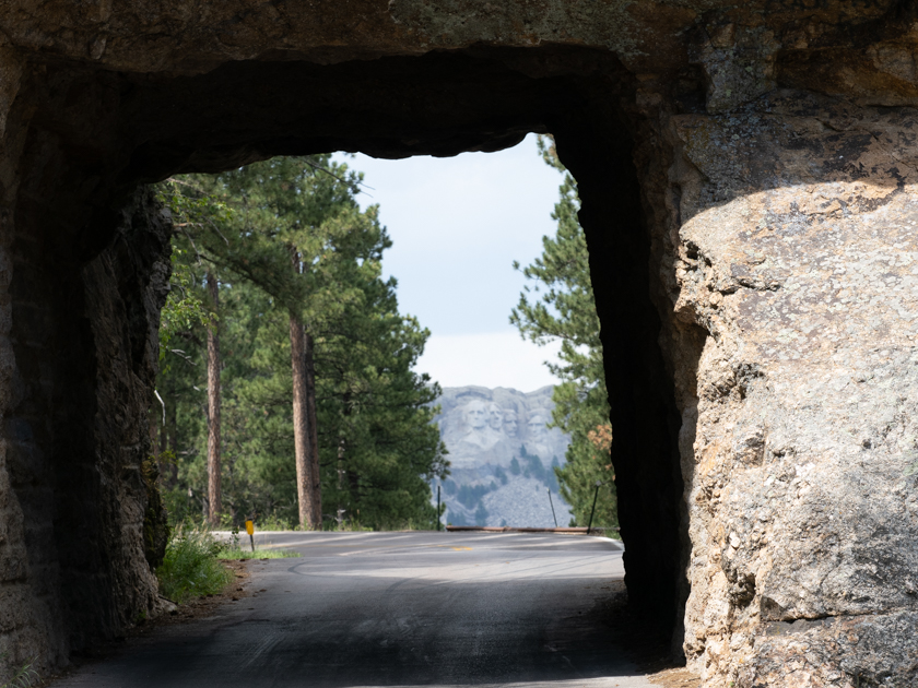Mount Rushmore framed through Shovel Johnson Tunnel on Iron Mountain Road in Custer State Park, South Dakota