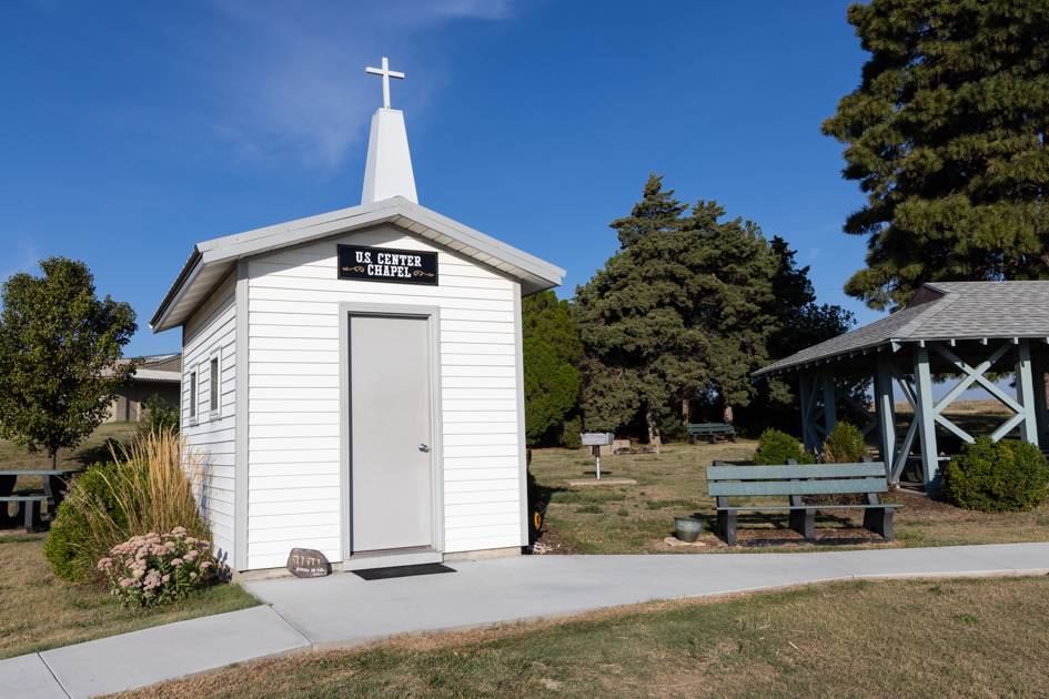 Small white chapel at the Geographic Center of the Continental United States in Lebanon, Kansas, surrounded by open prairie