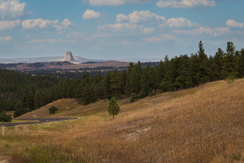 Distant view of Devil’s Tower rising from the Wyoming plains, seen from 13 miles away on the approach