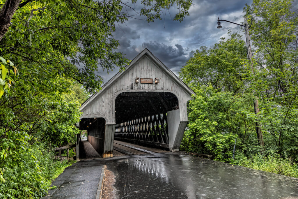Front and back view of Woodstock Middle Bridge in Vermont showing different colors on each side.
