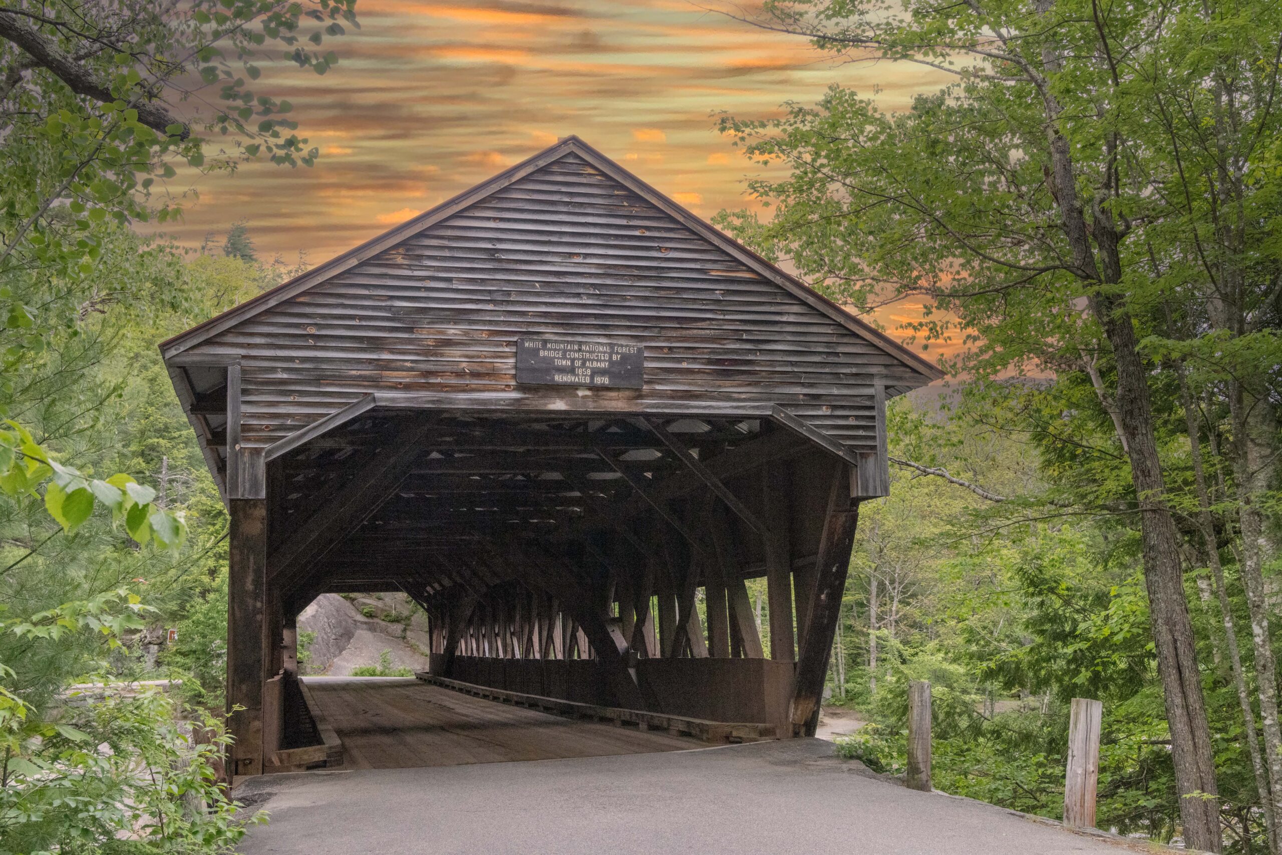 Front view of Albany Covered Bridge in New Hampshire’s White Mountains at sunset.