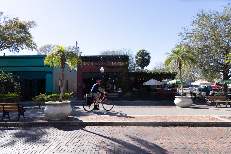 Cyclist riding along the Pinellas Trail bike path in Florida
