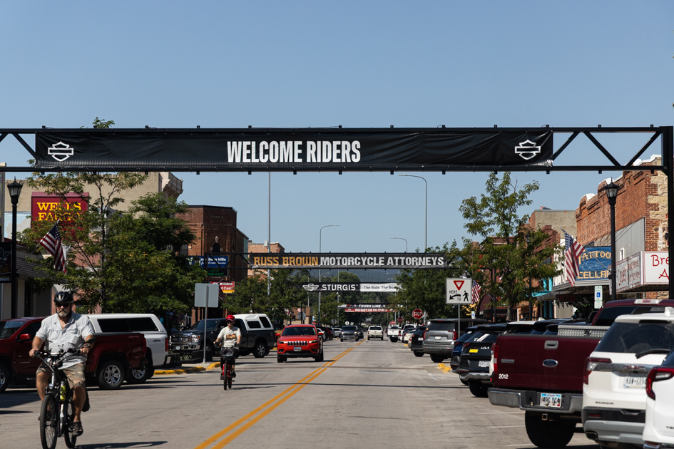 Sign across the road greeting motorcyclists in downtown Sturgis.