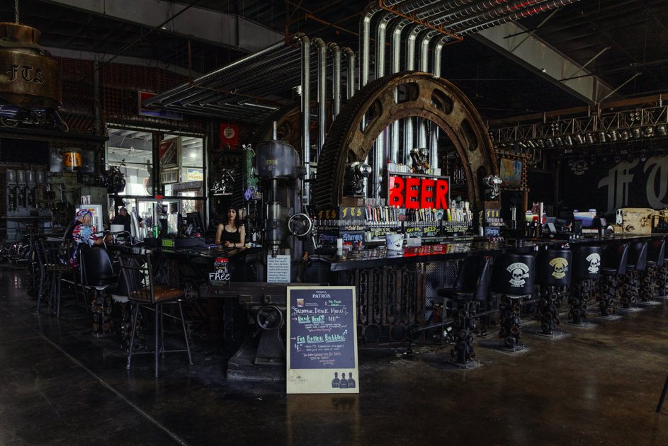 Back view of the bar at Full Throttle Saloon in Sturgis, featuring rustic design and biker-themed decor.