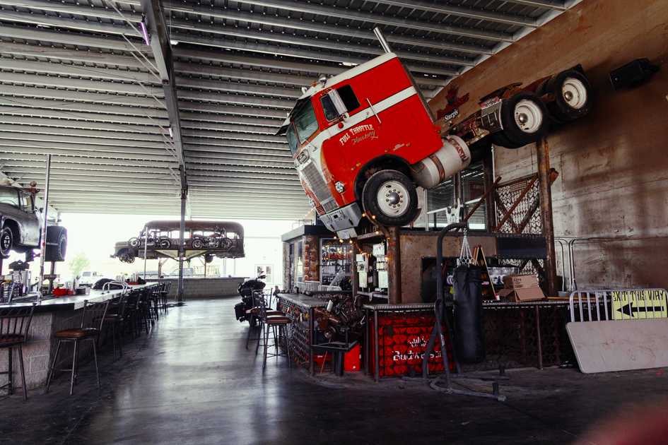 Interior of Full Throttle Saloon with a tractor trailer suspended above one of the bars.