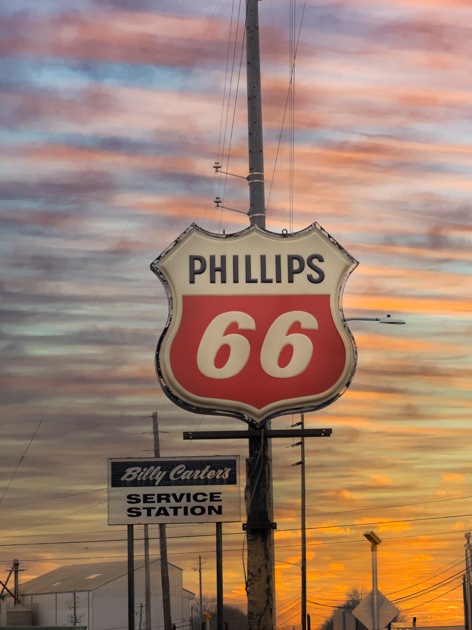 Vintage Phillips 66 sign at Billy Carter’s gas station in Plains, Georgia, against a clear Southern sky.

