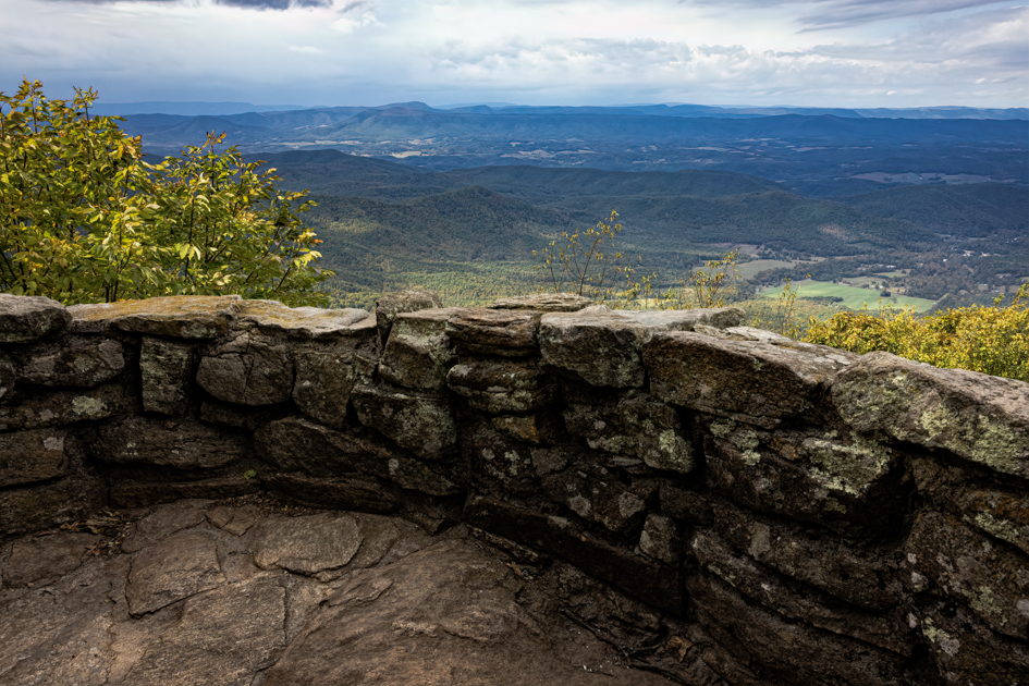 Sweeping mountain view from Thunder Ridge Overlook on the Blue Ridge Parkway, with ridgelines fading into the distance.
