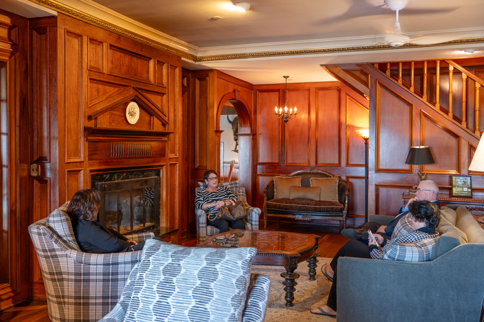Mirror Lake Inn lobby in Lake Placid with a roaring fireplace.
