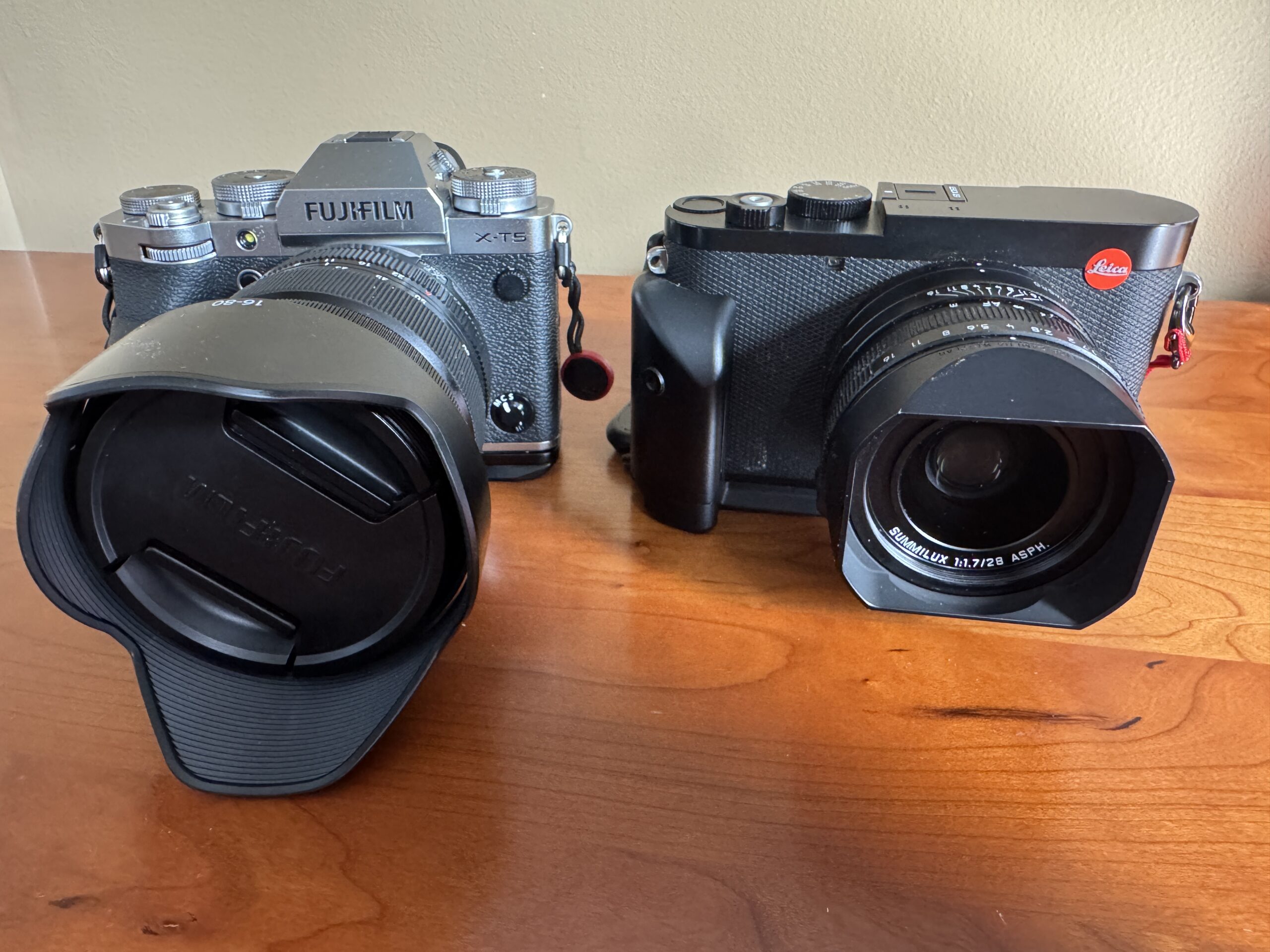 picture of Leica Q3 and Fuji X-T5 side by side, One-Lens Travel