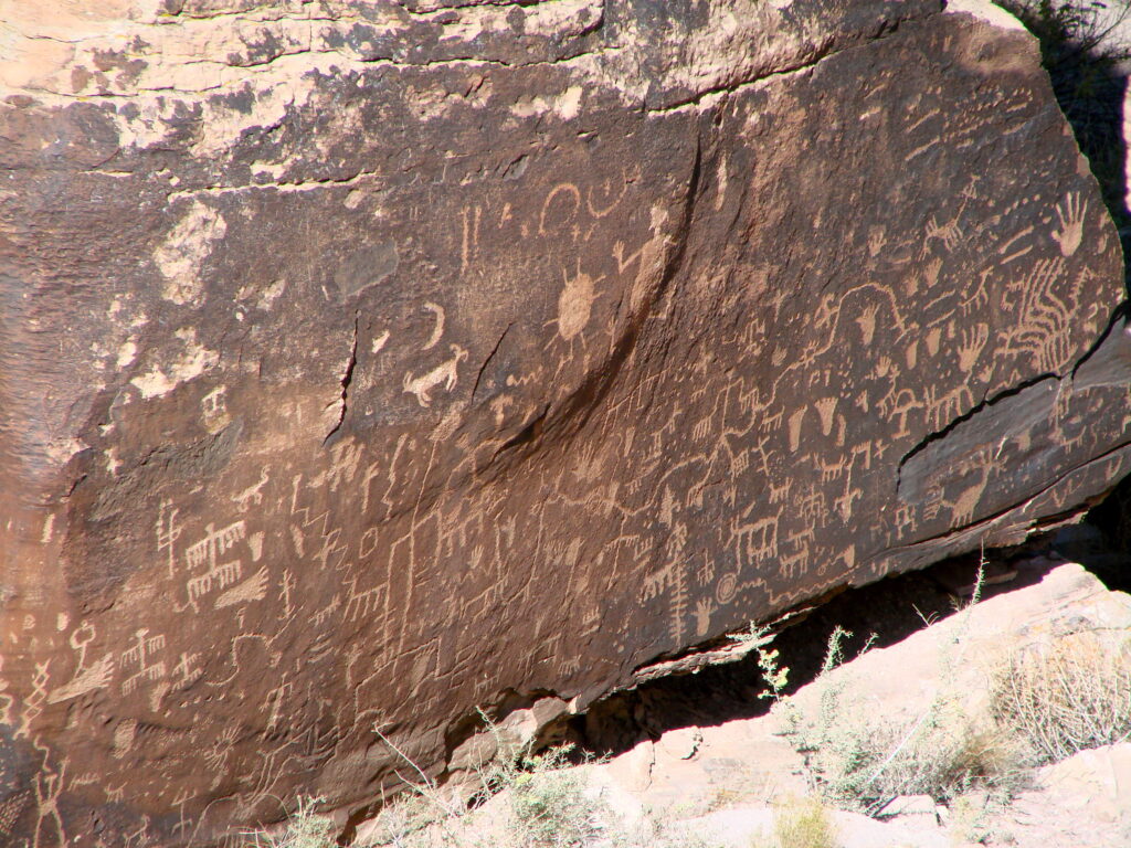 Detail of spiral and animal-shaped petroglyphs on Newspaper Rock in Petrified Forest NP
