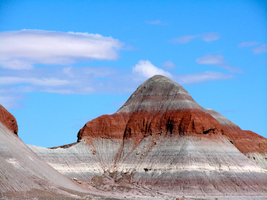 Dramatic ridges and colorful slopes of the Painted Desert hills with deep shadows