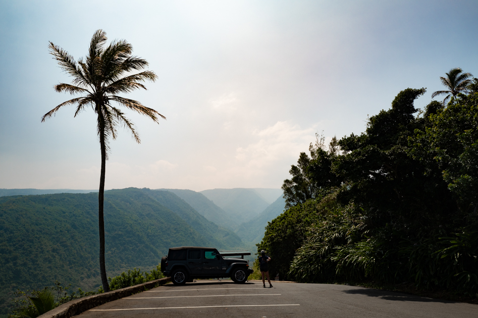 Trail descending from Pololū Valley Lookout toward the black sand beach below on Hawaii’s Big Island