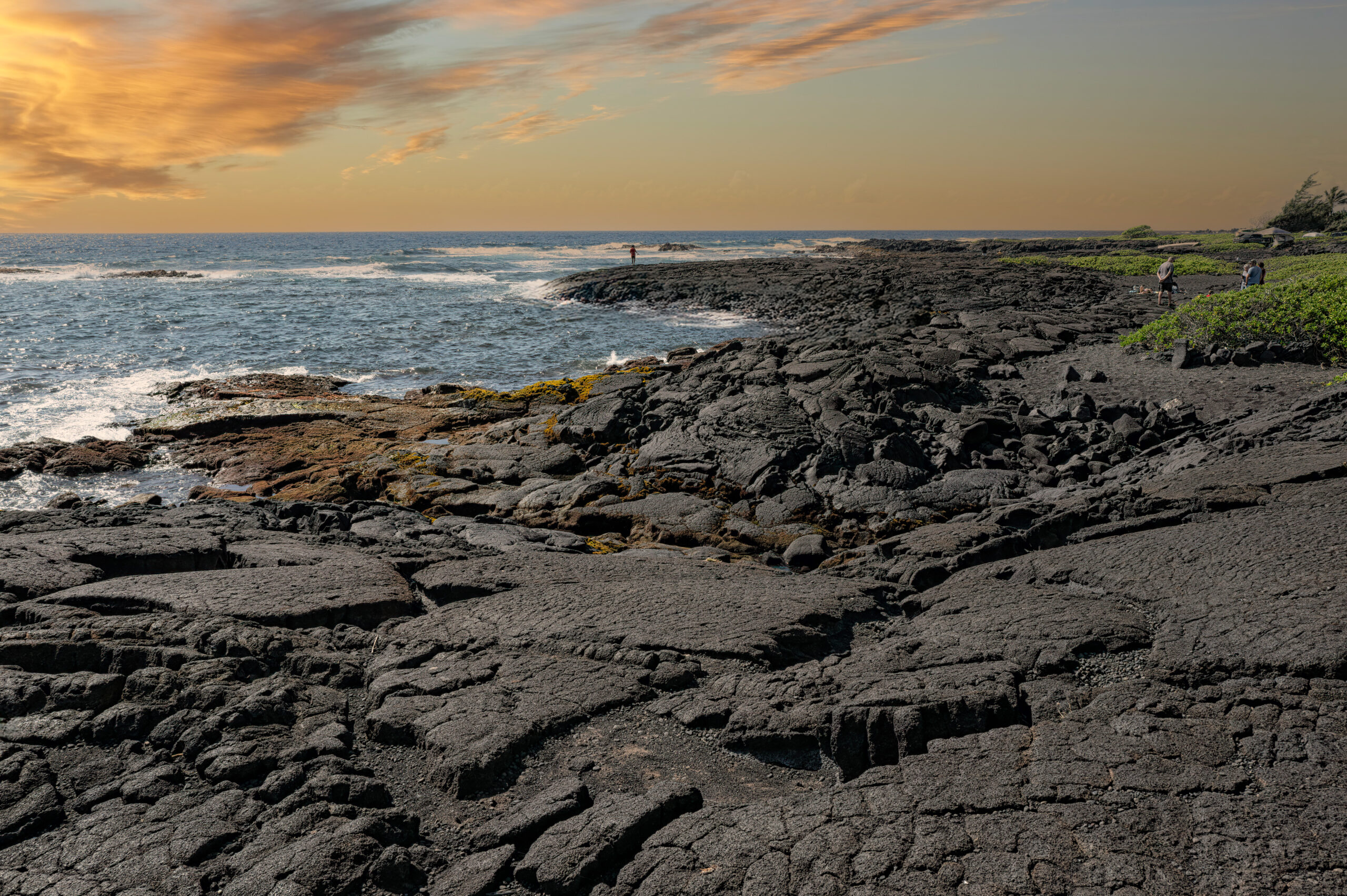 Sunset over the black sand at Punaluʻu Beach on Hawaii’s Big Island