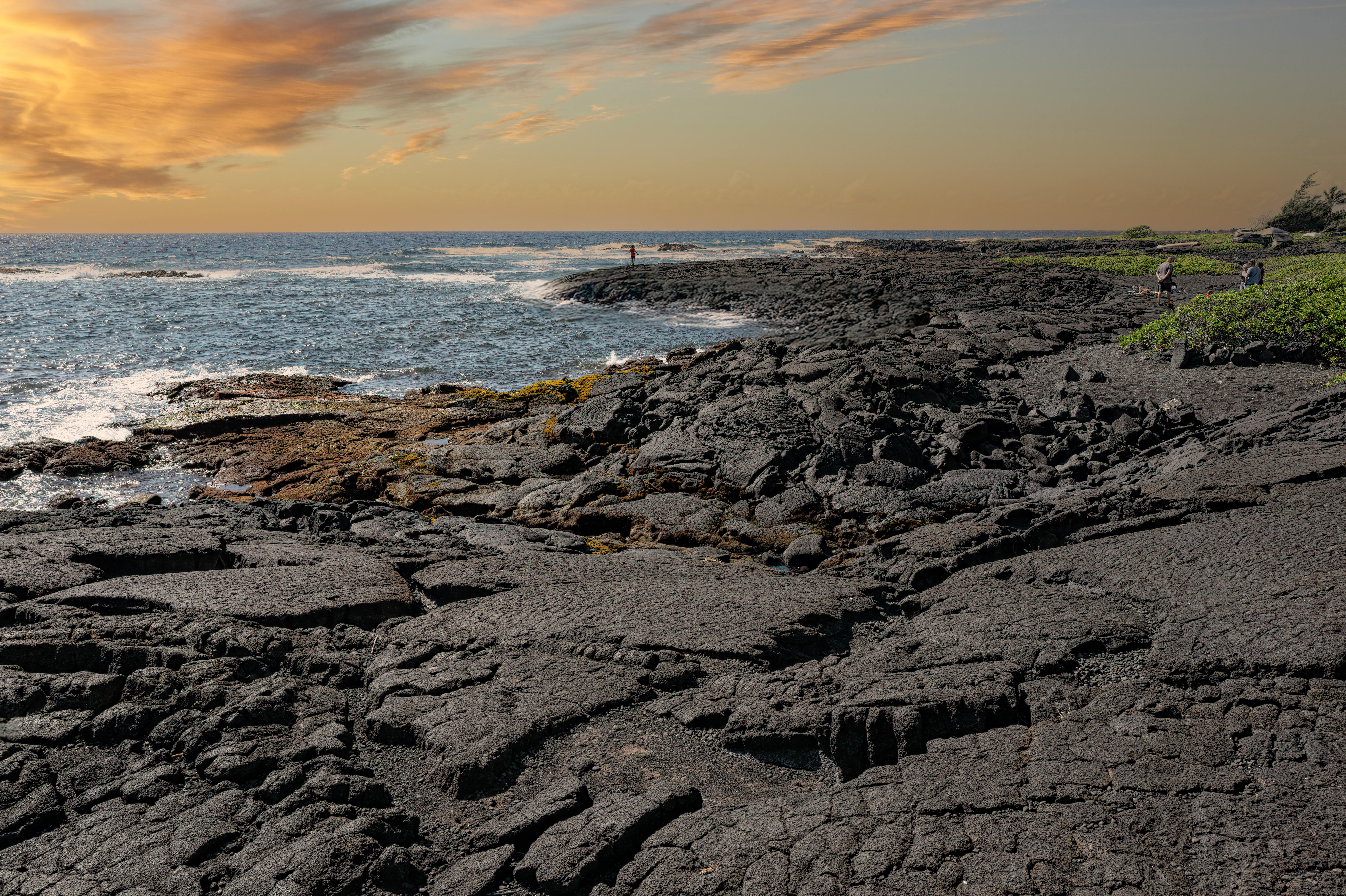 Sunset over the black sand at Punaluʻu Beach on Hawaii’s Big Island