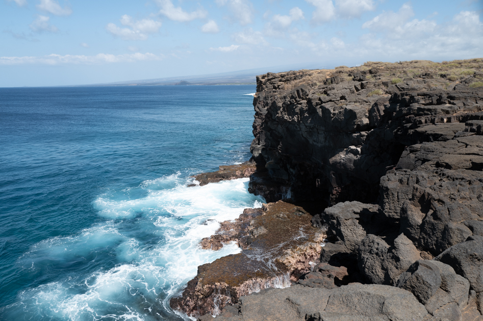 Cliffs and turquoise ocean at South Point, the southernmost tip of the Big Island of Hawaii