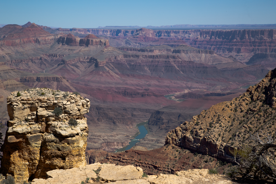 Grand Canyon view with the Colorado River winding through deep red rock cliffs
