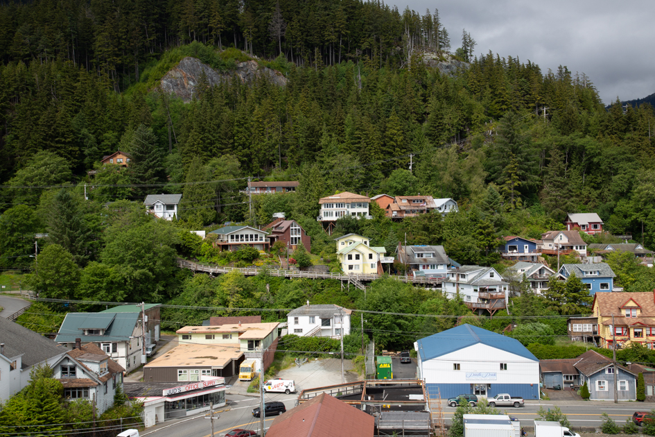 Panoramic view of Ketchikan, Alaska built along steep hillsides overlooking the harbor
