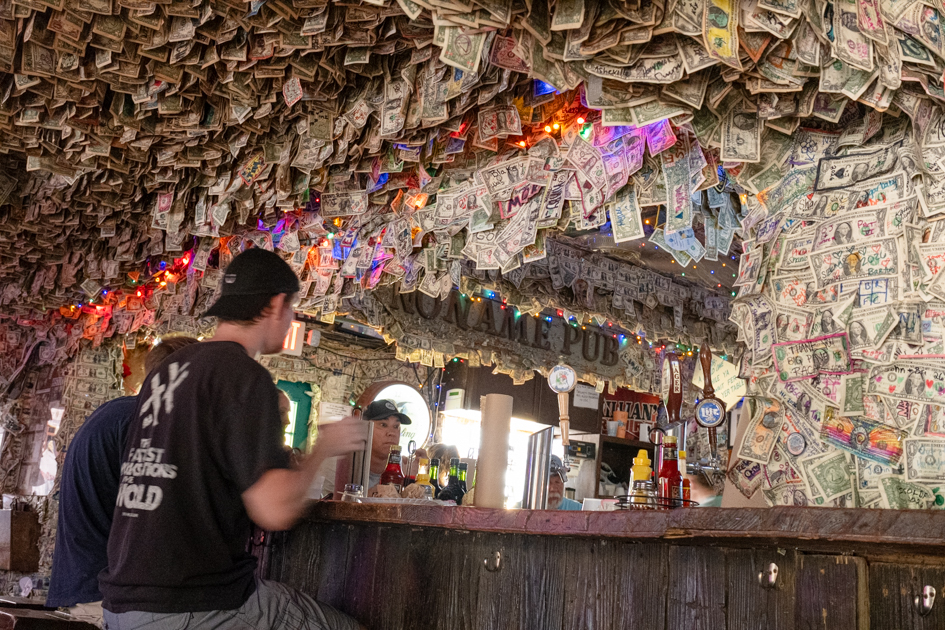 Alt Text:
No Name Pub interior walls covered in dollar bills Florida Keys