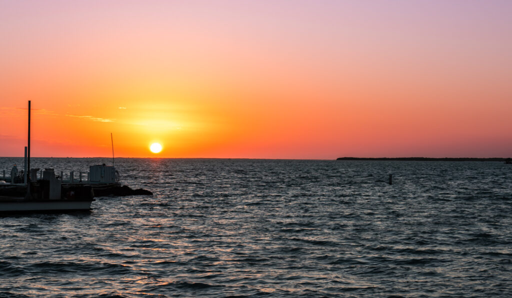 Sunset over the Gulf Coast at Sun Outdoors Key Largo with calm water and soft evening light