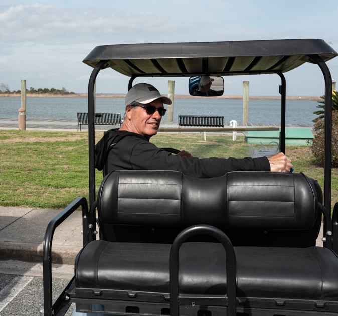 Golf cart overlooking Apalachicola waterfront view