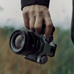 Fue Fuji X-T5 hand carried by a photographer