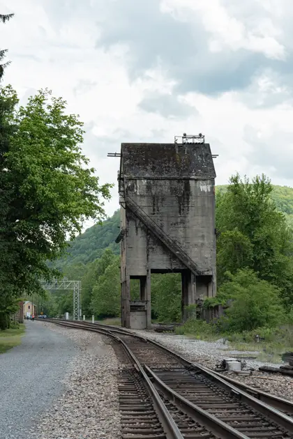 Weathered concrete coaling tower beside the rail yard in Thurmond.