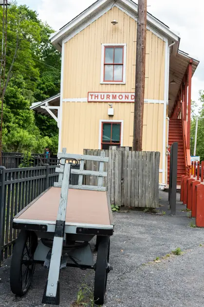 Historic railroad depot in Thurmond beside the tracks in the New River Gorge.