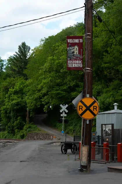 Historic railroad sign marking Thurmond along the tracks in the New River Gorge.
