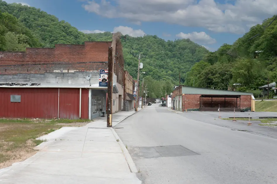 Historic buildings lining the quiet downtown streets of War in the Appalachian mountains.