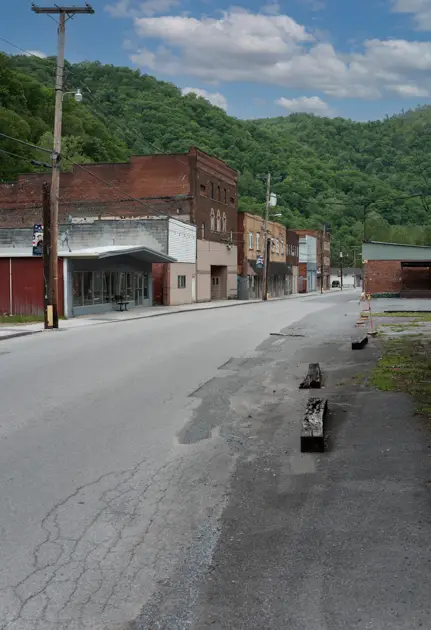 Small-town streets and older storefronts in downtown War.