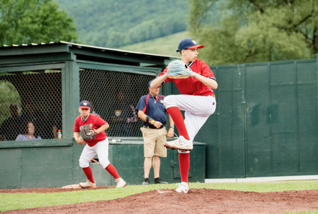 picture of a pitcher pitching on the filed at Cooperstown Dreams Park