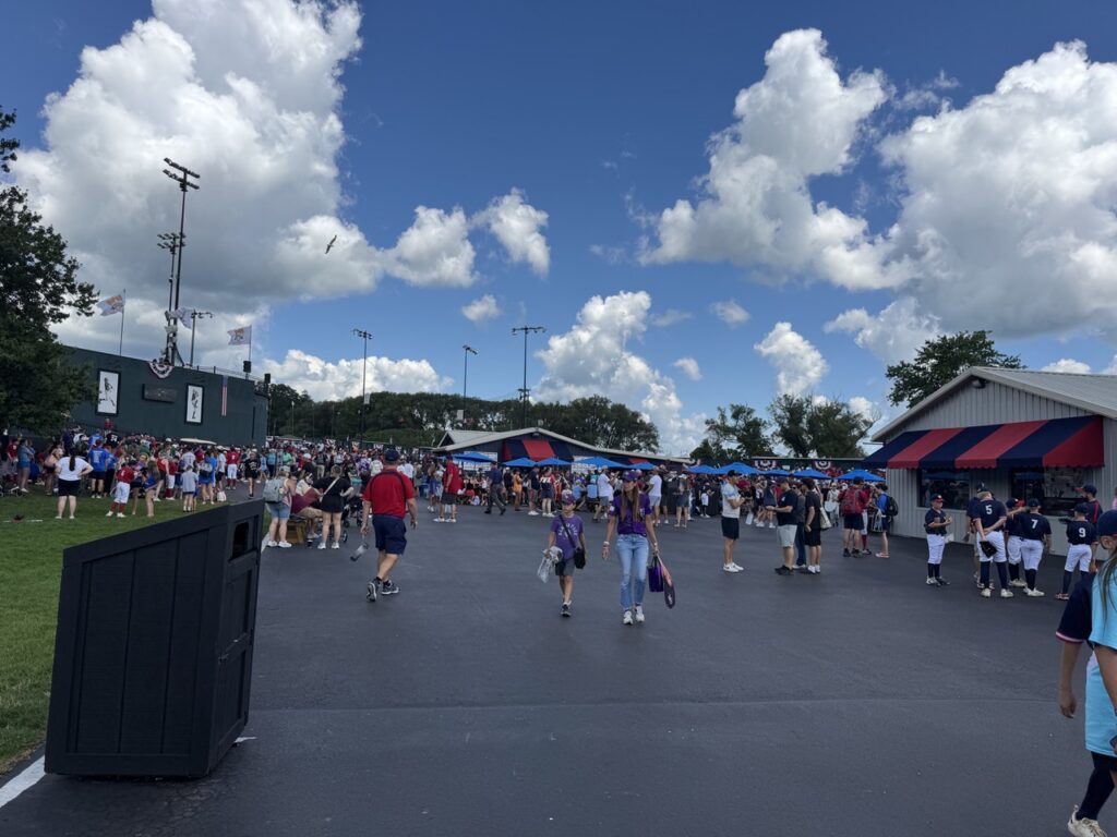 Crowds of players, families, and spectators at Cooperstown Dreams Park in Cooperstown, New York.